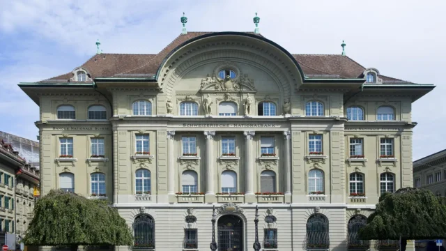 Neoclassical facade representing traditional banking contrasted with Bitcoin-native banking